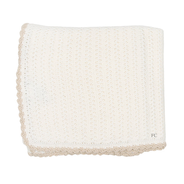 Ivory/beige knitted blanket by Chant De Joie