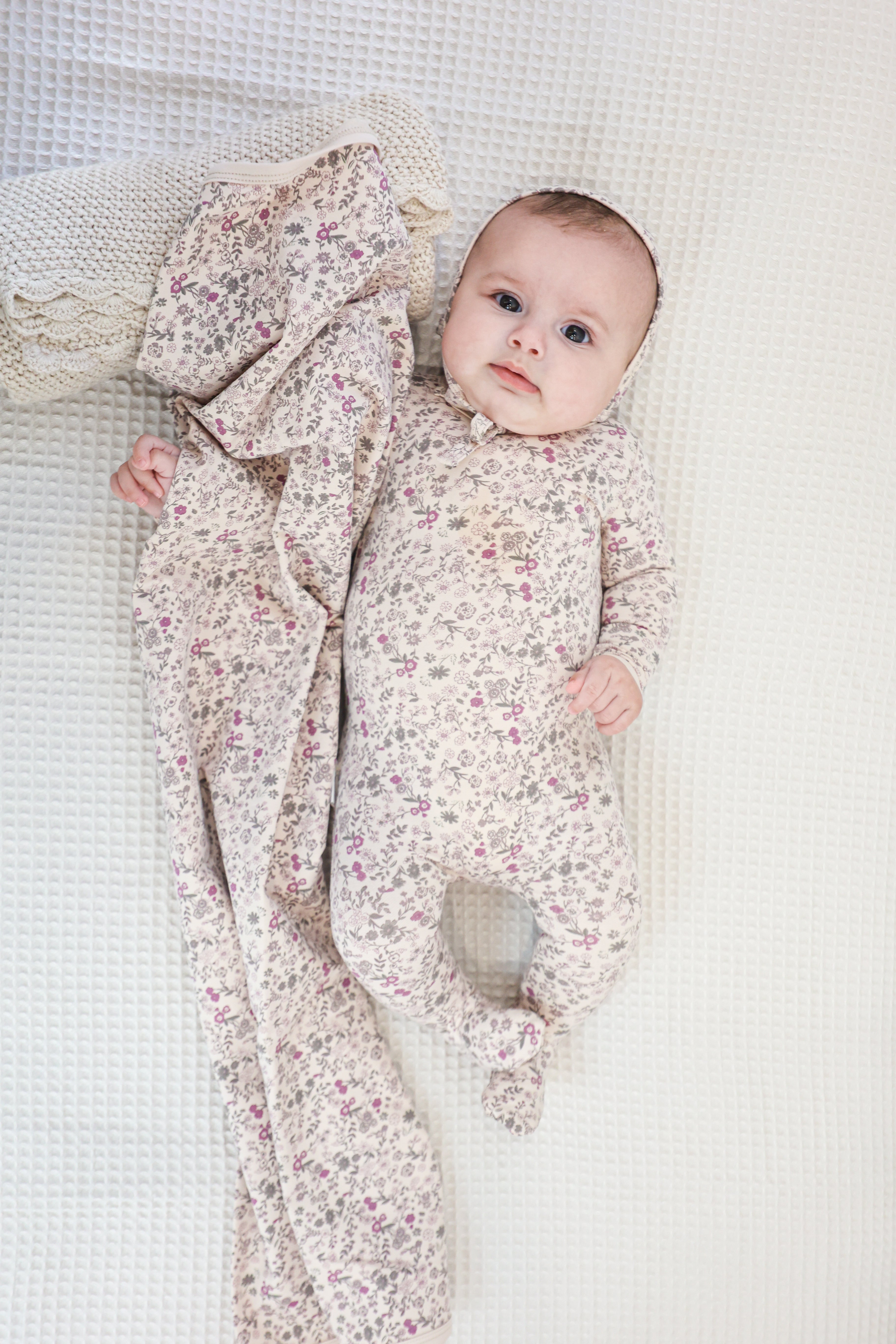 Elegant floral biscuit footie by Maniere