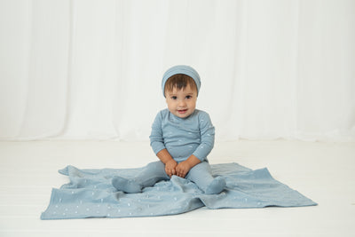 Embroidered blue blanket by Bee & Dee