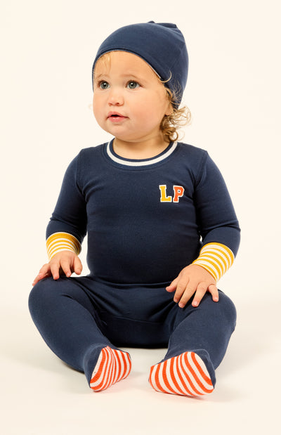 Varsity navy colorblock footie by Little Parni