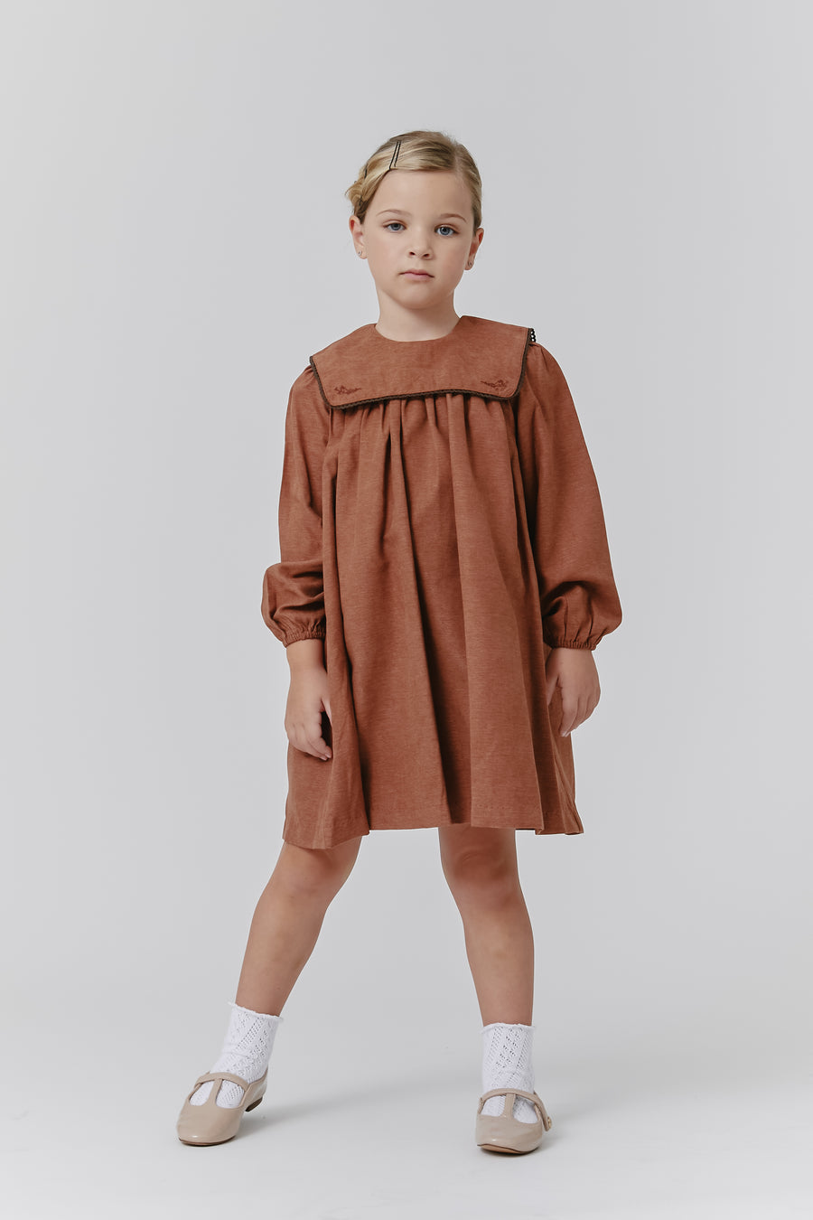 Brown bib dress by Kipp