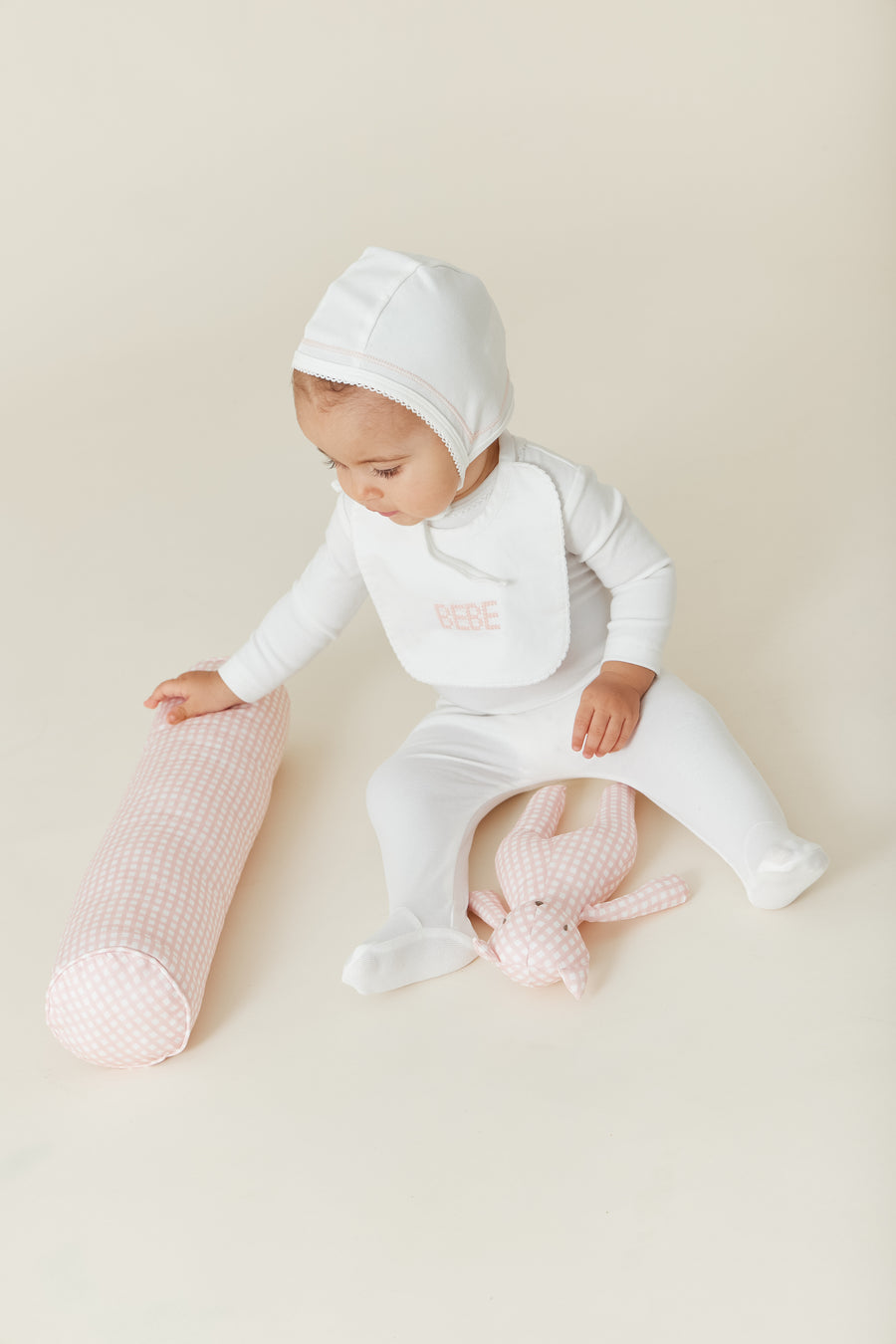 Gingham pink teddy rattle by Kipp Baby