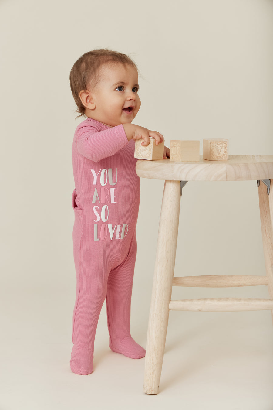 Text pink rib footie by Kipp Baby