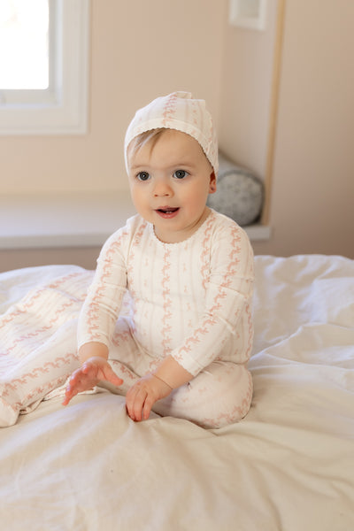 Linear nostalgia pink footie + beanie by Bee & Dee