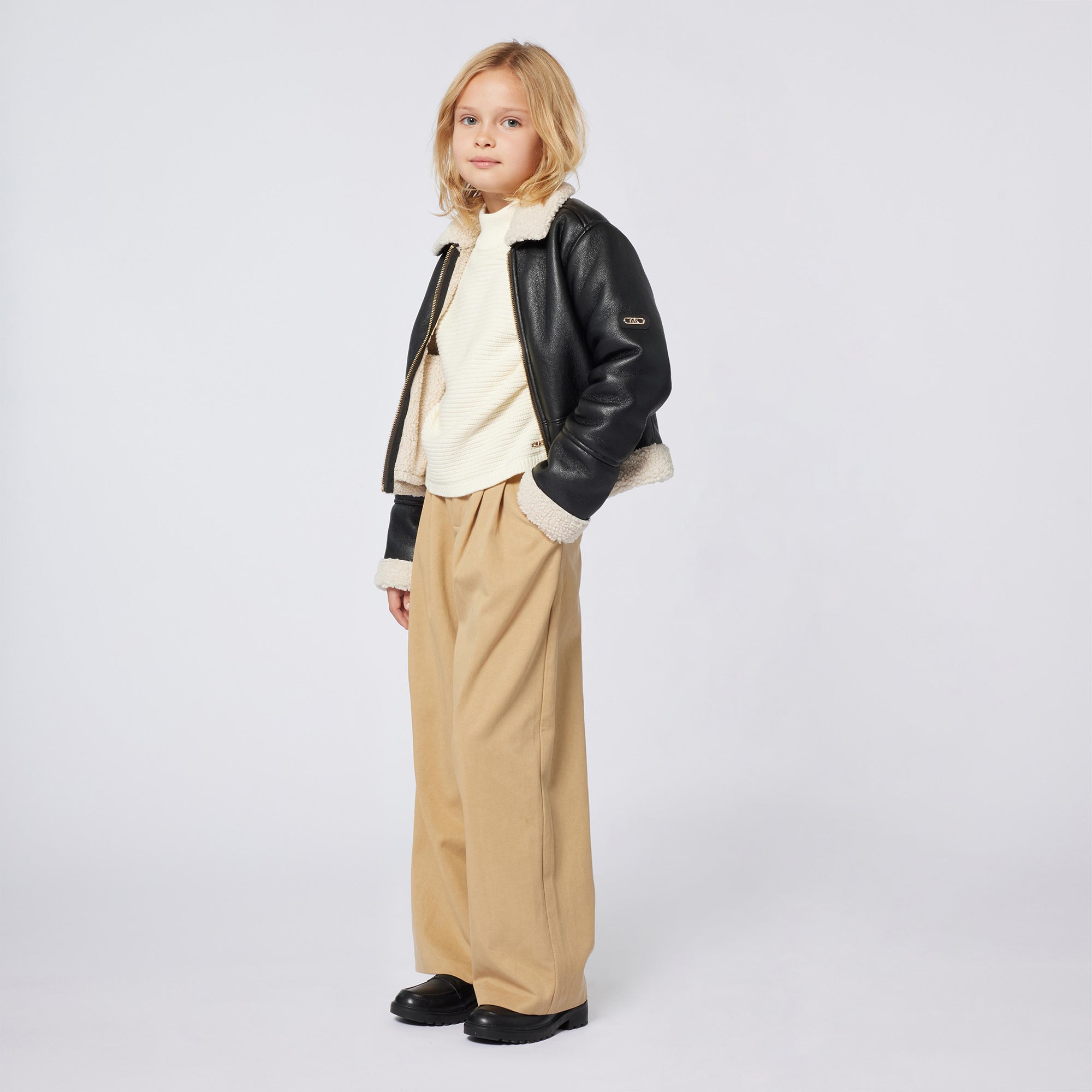 Cream turtleneck sweater by Michael Kors