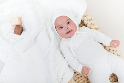 Bisous white bib footie + bonnet by Kipp Baby