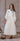 Coco Blanc Pleated bow detail dress