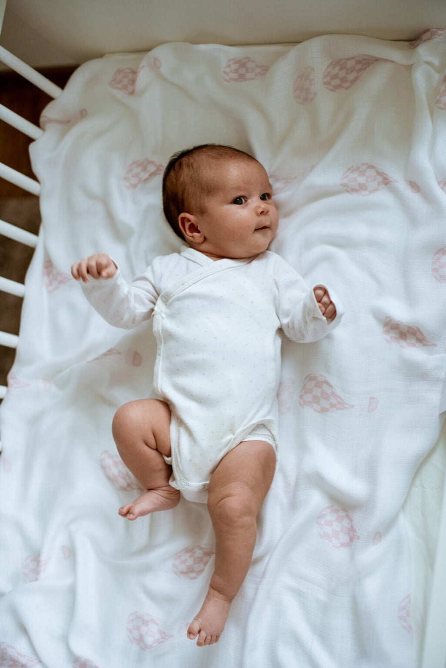 Powder pink hot air balloons swaddle by Petite Laure