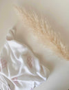 Powder pink hot air balloons swaddle by Petite Laure