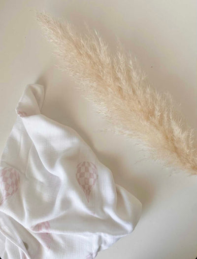 Powder pink hot air balloons swaddle by Petite Laure